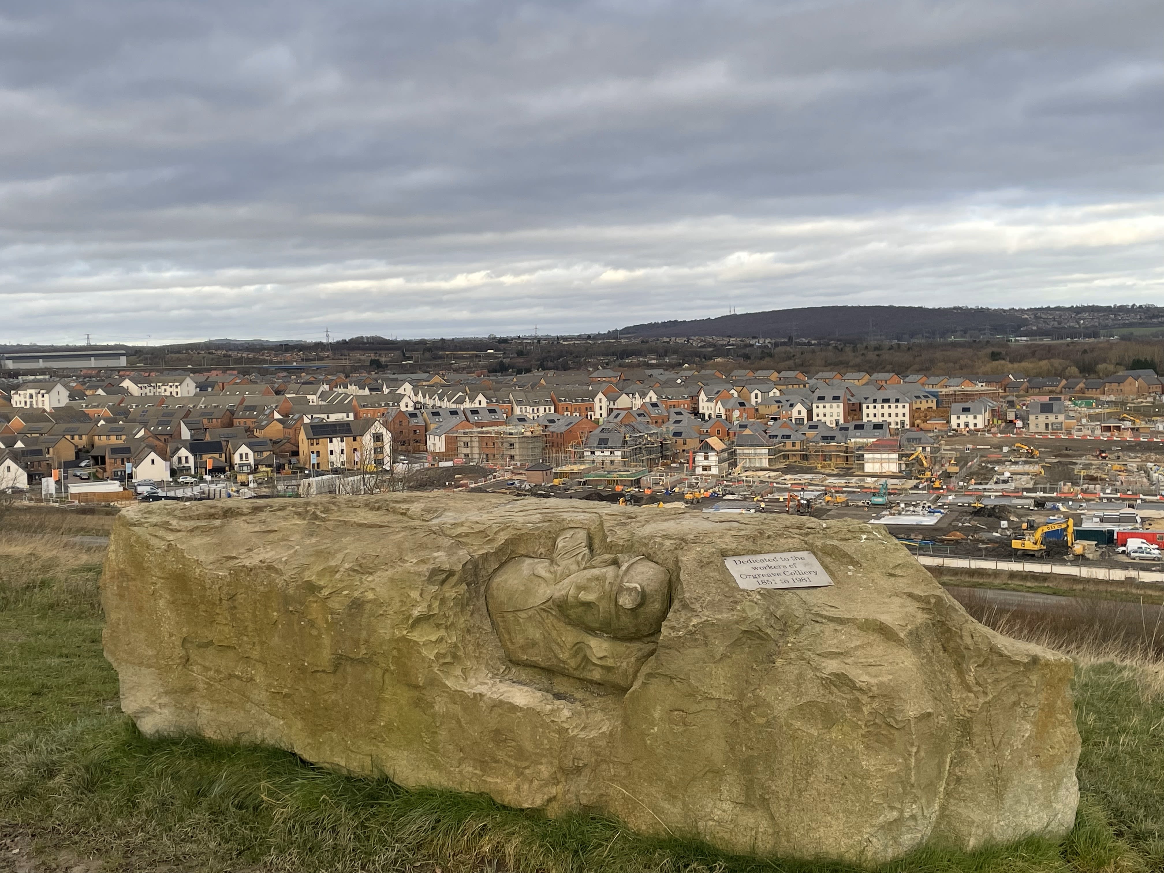 A photo of the Orgreave Memorial, overlooking a nearby resedential estate