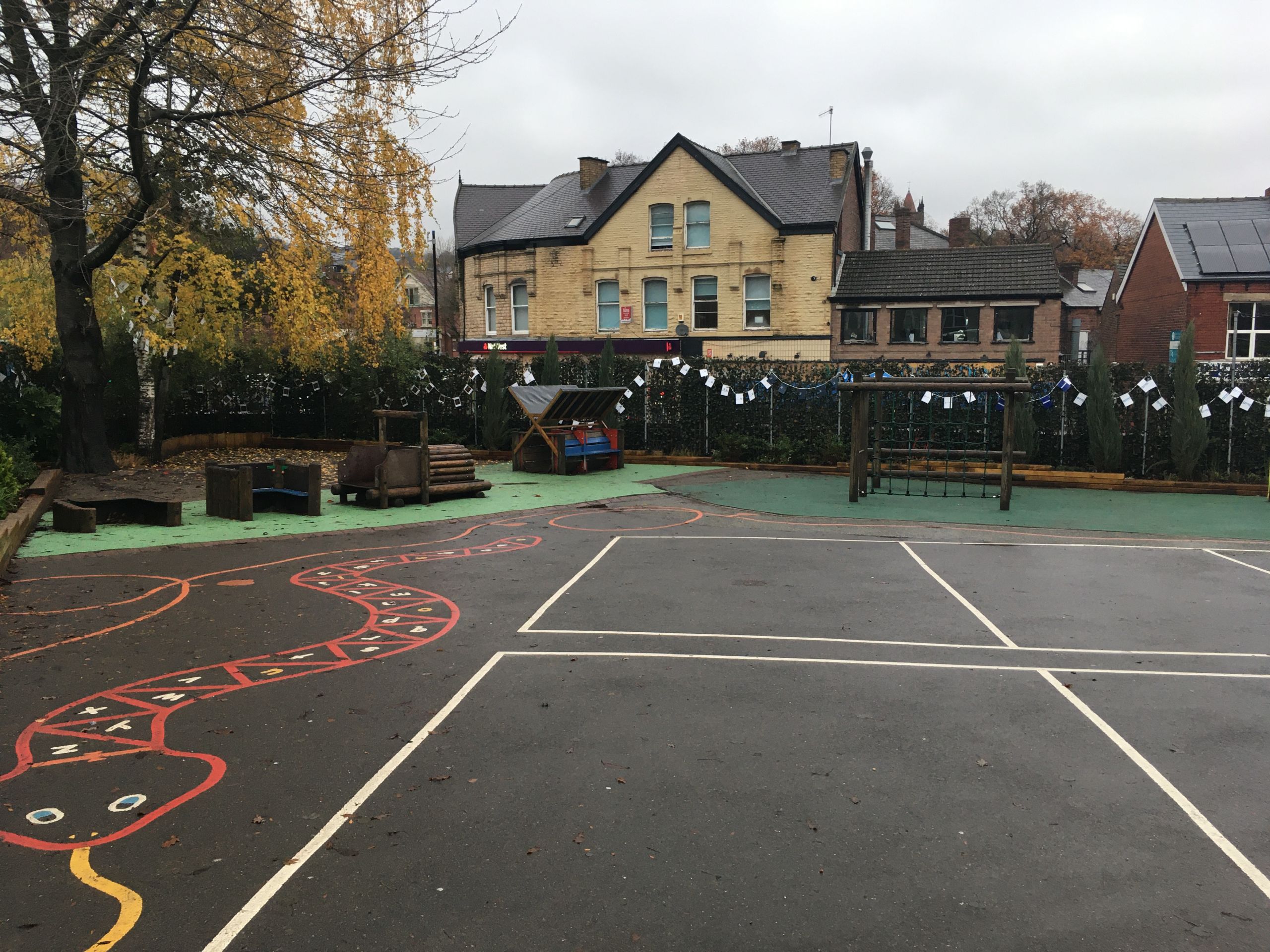 The school yard with the newly installed green barrier