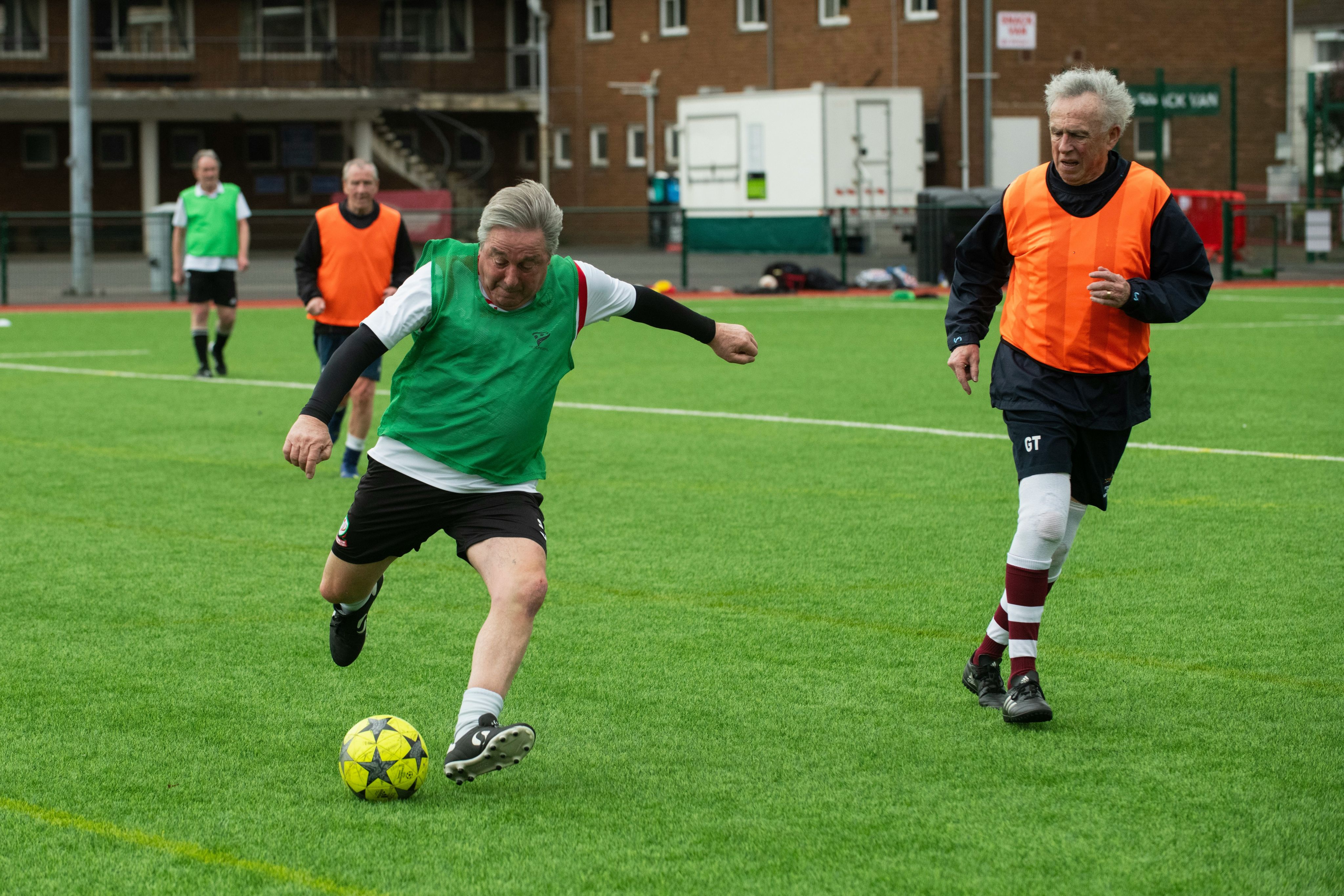 A group of men playing a game of soccer