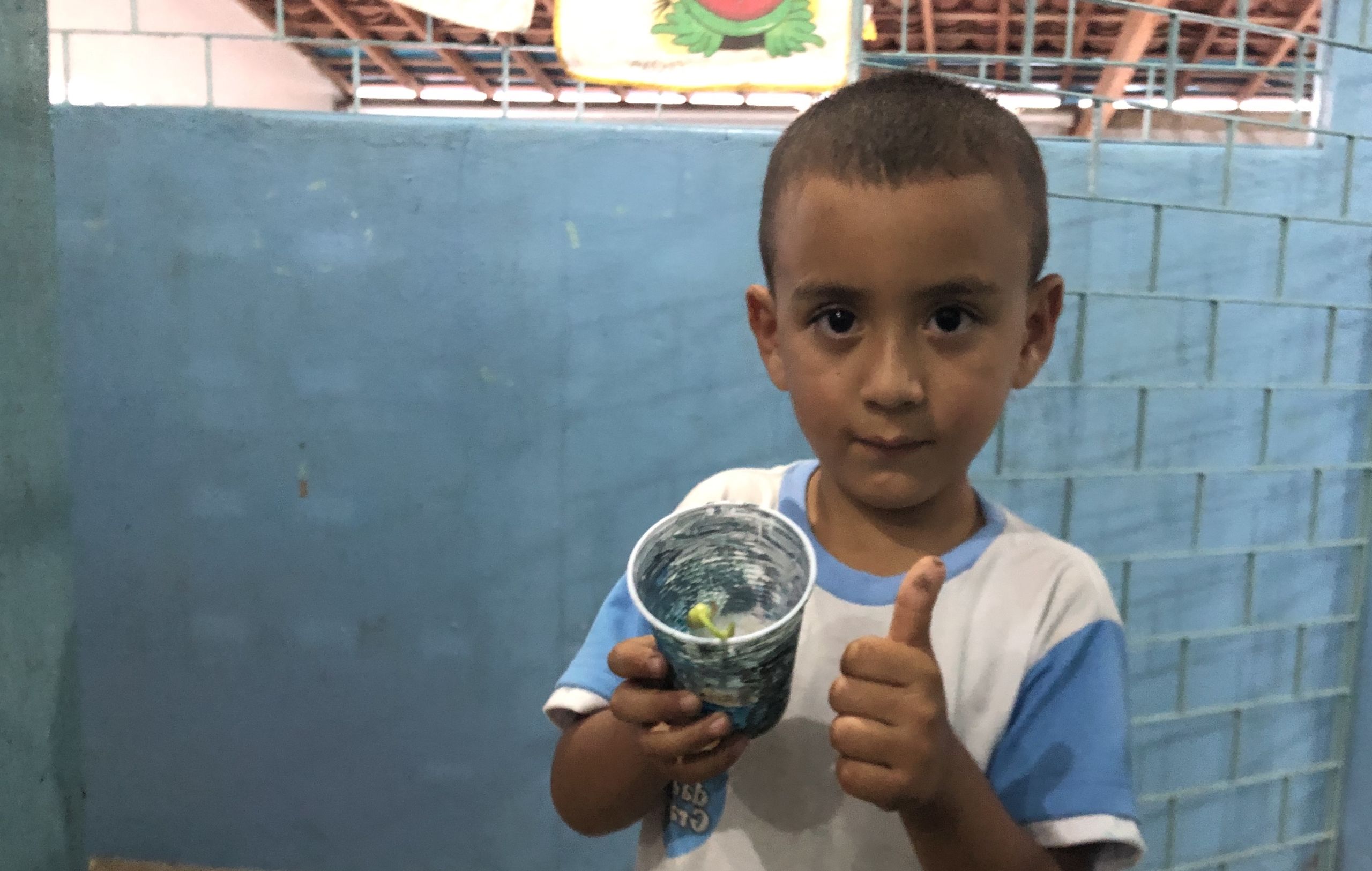 The children showing their plants